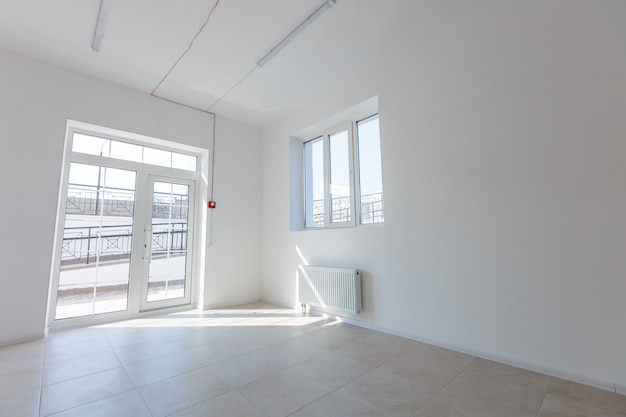 Office extension that uses bricks as a wall, construction, improvement. Interior of small room with window and bricks walls renovation, extension, overhaul and reconstruction.