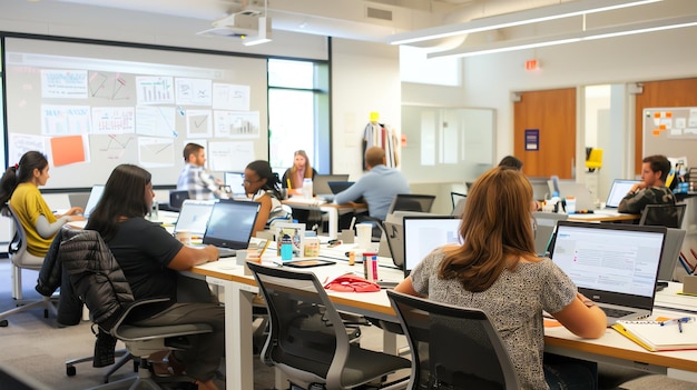 An office full of people working at their desks Some people are sitting others are