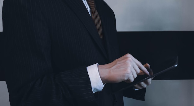 Office manager pressing tablet screen closeup concept image