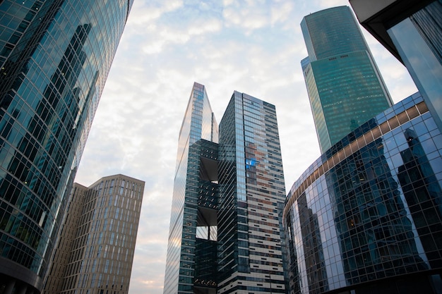 Office and residential skyscrapers over  blue sky background. Commercial real estate. Modern business city district. Office buildings exterior.