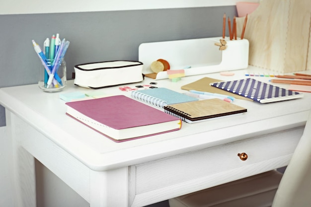 Office and school set with stationery and notebooks on a table