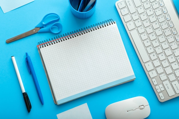 Office and school white blue stationery on pastel blue layout for work and education. back to school concept with mockup blank copy space. Blue desk workspace.