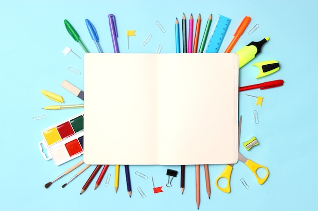 Office supplies on a colored background closeup back to school concept