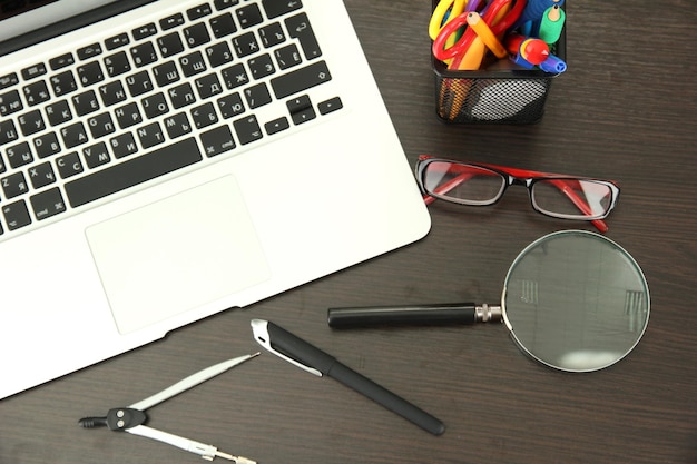 Office supply and laptop isolated on white