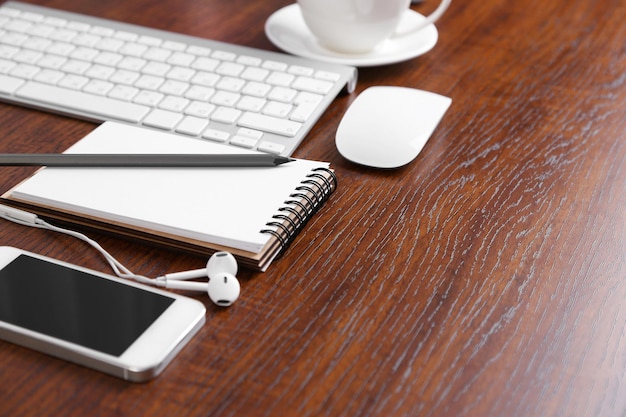 Office table with supplies and gadgets