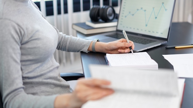 Office work concept a female officer using her tablet to work on a document job in the office.