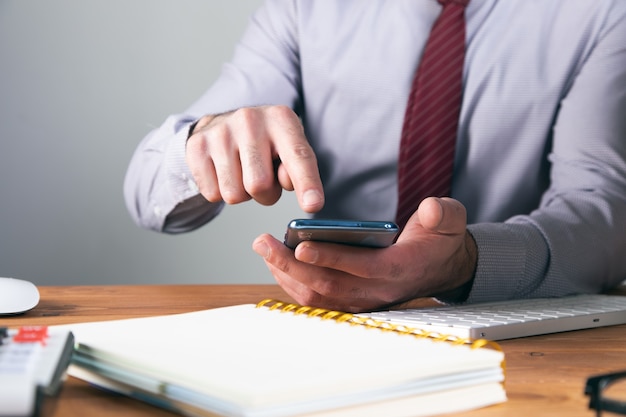 Office worker clicks on the phone .