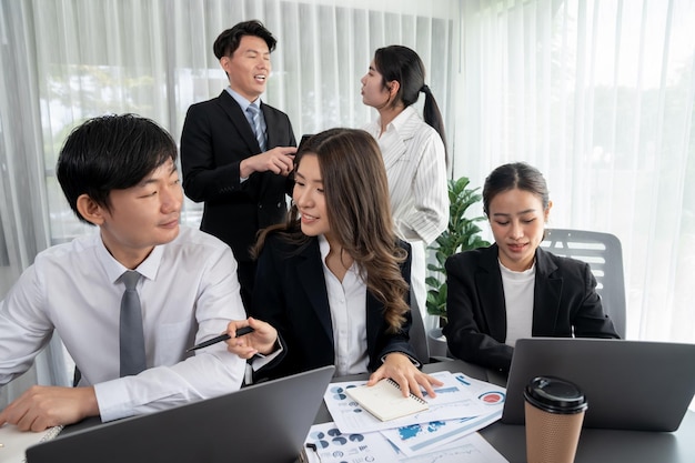 Office worker and manager analyze financial report paper in harmony workplace