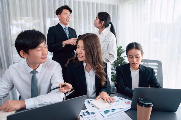 Office worker and manager analyze financial report paper in harmony workplace