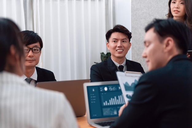 Office worker and manager analyze financial report paper in harmony workplace