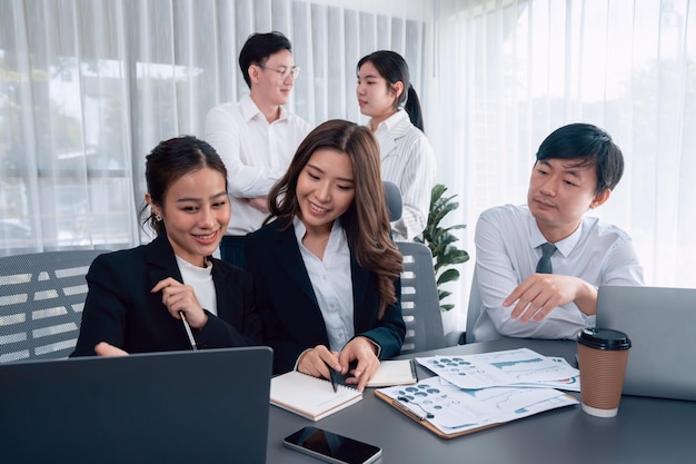 Office worker and manager analyze financial report paper in harmony workplace