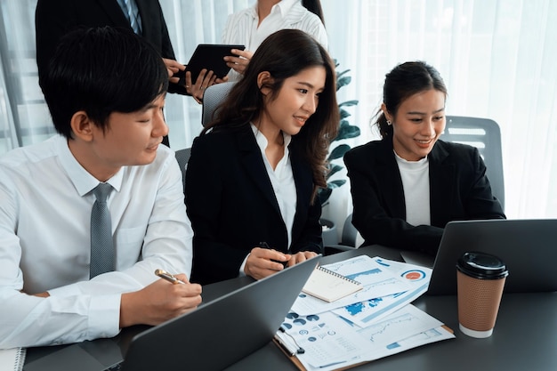 Office worker and manager analyze financial report paper in harmony workplace