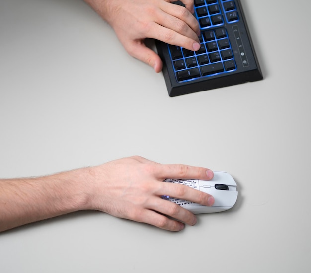 A office worker using a new white computer mouse