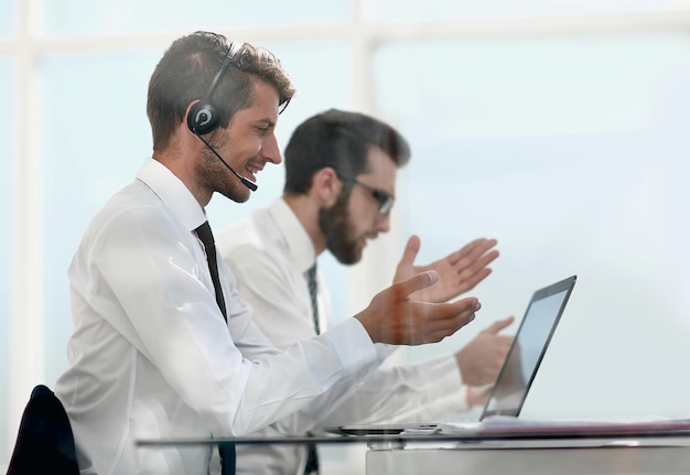 Office worker with headset on while having video conferencephoto with copy space