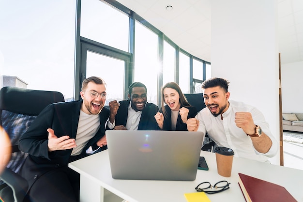 Office workers cheer for the company