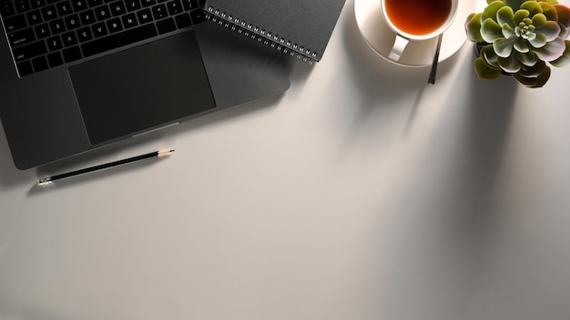 Office working table with laptop computer decor and copy space on white table background