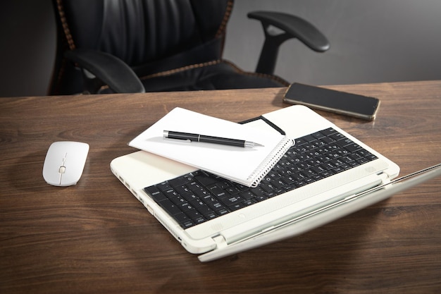 Office workplace Notepad smartphone laptop computer mouse