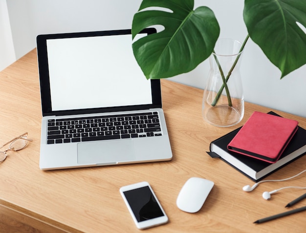 Office workplace with laptop on wooden table