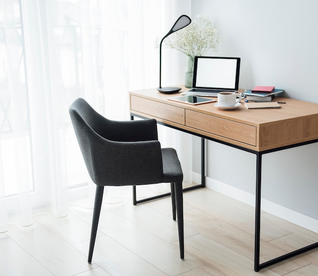 Photo office workplace with laptop on wooden table