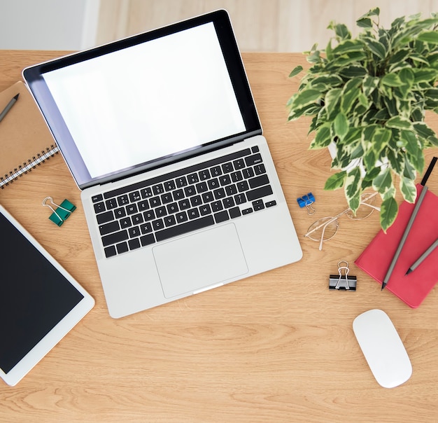 Office workplace with laptop on wooden table