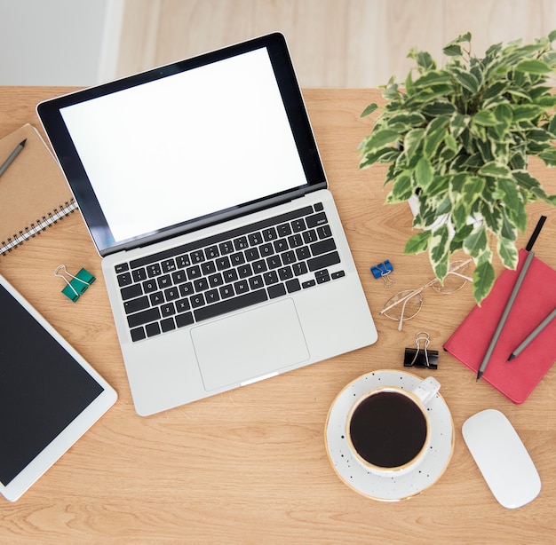 Office workplace with laptop on wooden table