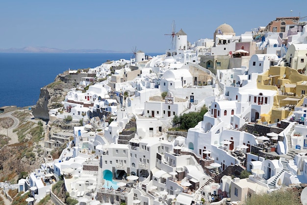 Oia town and its famous windmills on Santorini island Greece