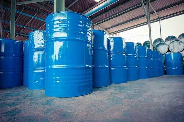 Oil barrels blue  or chemical drums horizontal and vertical stacked up