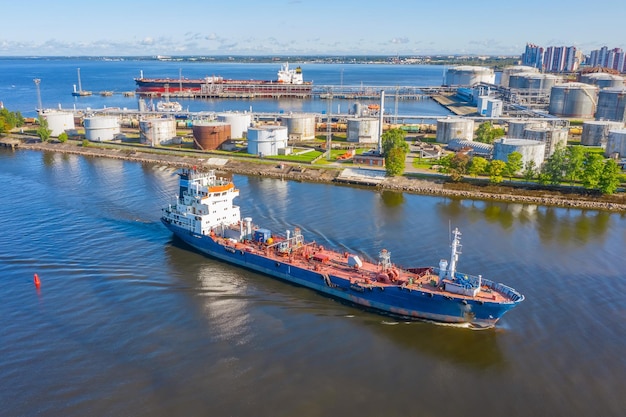 Oil and gas industrial loading port tanker sailing in the river channel