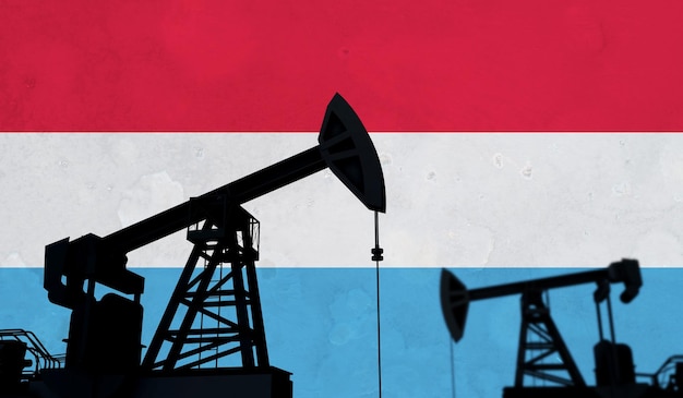 Oil and gas industry background oil pump silhouette against luxembourg flag d rendering