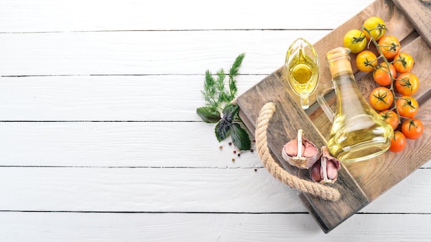 Oil in a glass jar Olive oil Top view On a white wooden background Free space for text