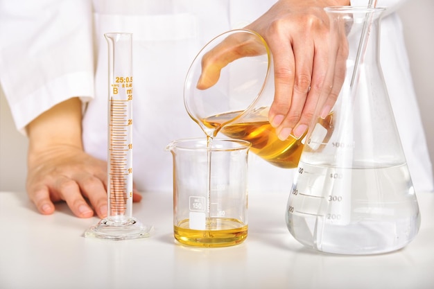 Oil pouring Laboratory and science experiments Formulating the chemical for medical research Quality control of petroleum industry products concept