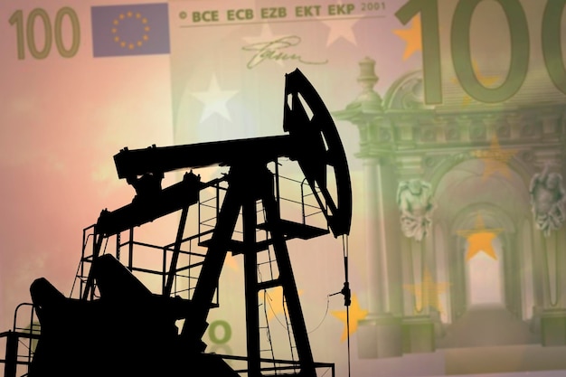 Oil pump on background of euro banknote