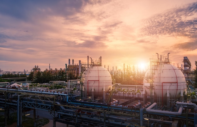 Oil refinery industrial plant at sunset