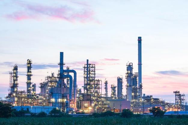 Oil refinery and plant and tower column of Petrochemistry industry in oil and gas industrial with cloud blue sky the morning