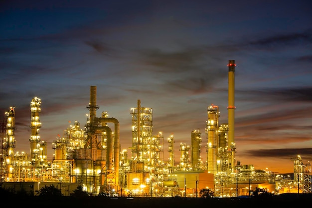 Oil refinery and plant and tower column of Petrochemistry industry in oil and gas industrial with cloud blue sky the morning