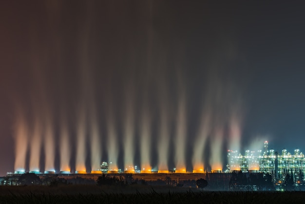 Oil refinery at twilight with sky background