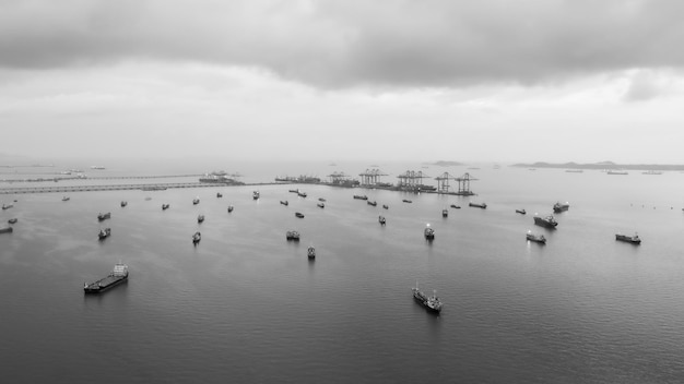 Oil ship tanker parking in sea and cloud storm background at evening