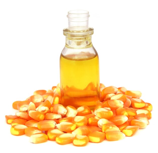 Oil with corn over white background