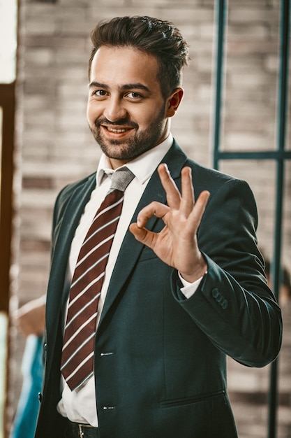 Okey gesture from Attractive successful businessman