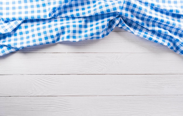 Oktoberfest festival decoration symbols made from Bavarian white and blue fabric on white wooden background