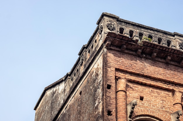 Old abandoned brick structural building under the blue sky with copy space