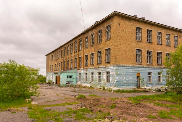 An old abandoned school in the ghost town of Sovetsky. Abandoned settlement. Vorkuta, Russia.