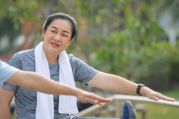 Old Asian woman exercise outdoor Asian woman happy retirement