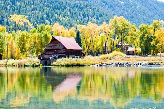 Old barn by the lake in autumn. Near Lake City, Colorado.