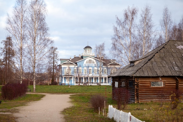 An old beautiful mansion with a wooden veranda, built in the 19th century. A big old house