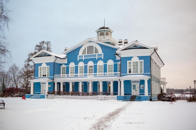 An old beautiful mansion with a wooden veranda, built in the 19th century. A big old house