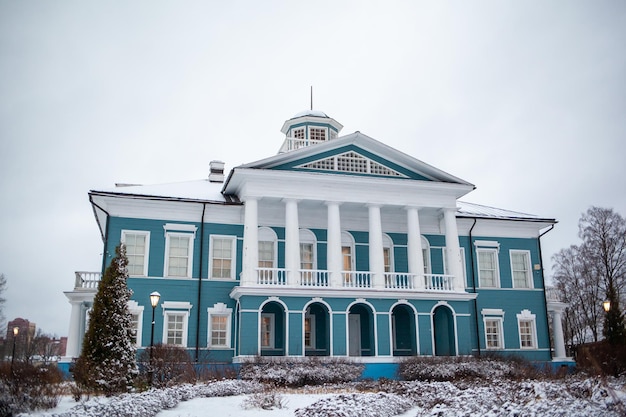 An old beautiful mansion with a wooden veranda, built in the 19th century. A big old house