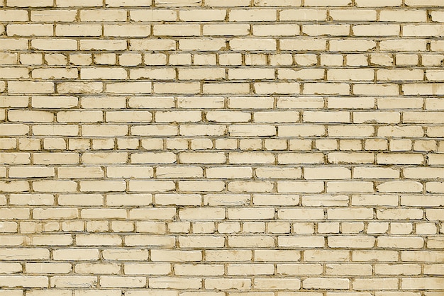 Old beige brick wall background texture