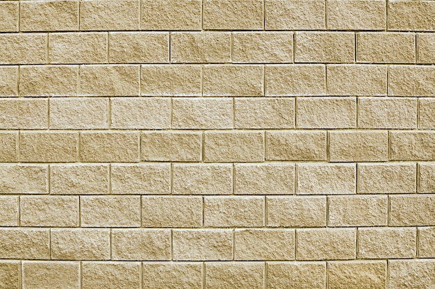 Old beige stone wall background texture