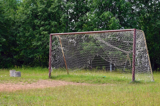 Old  big football goal with grid.